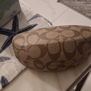 Coach Brown and Tan Patterned Storage Pillow